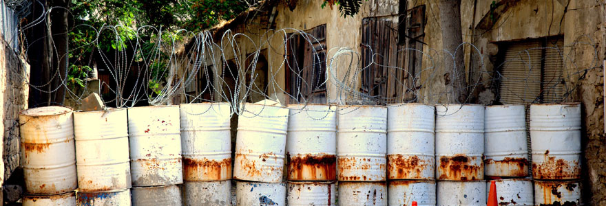 Makeshift border divider made of barrels, in Cyprus